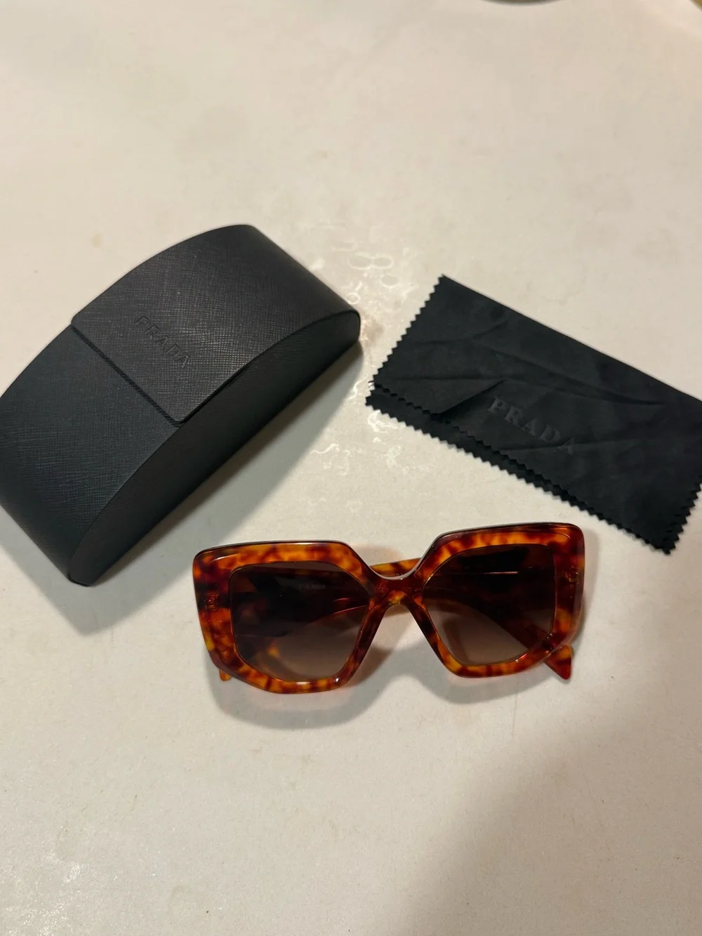Prada Tortoiseshell Sunglasses With Side Logo